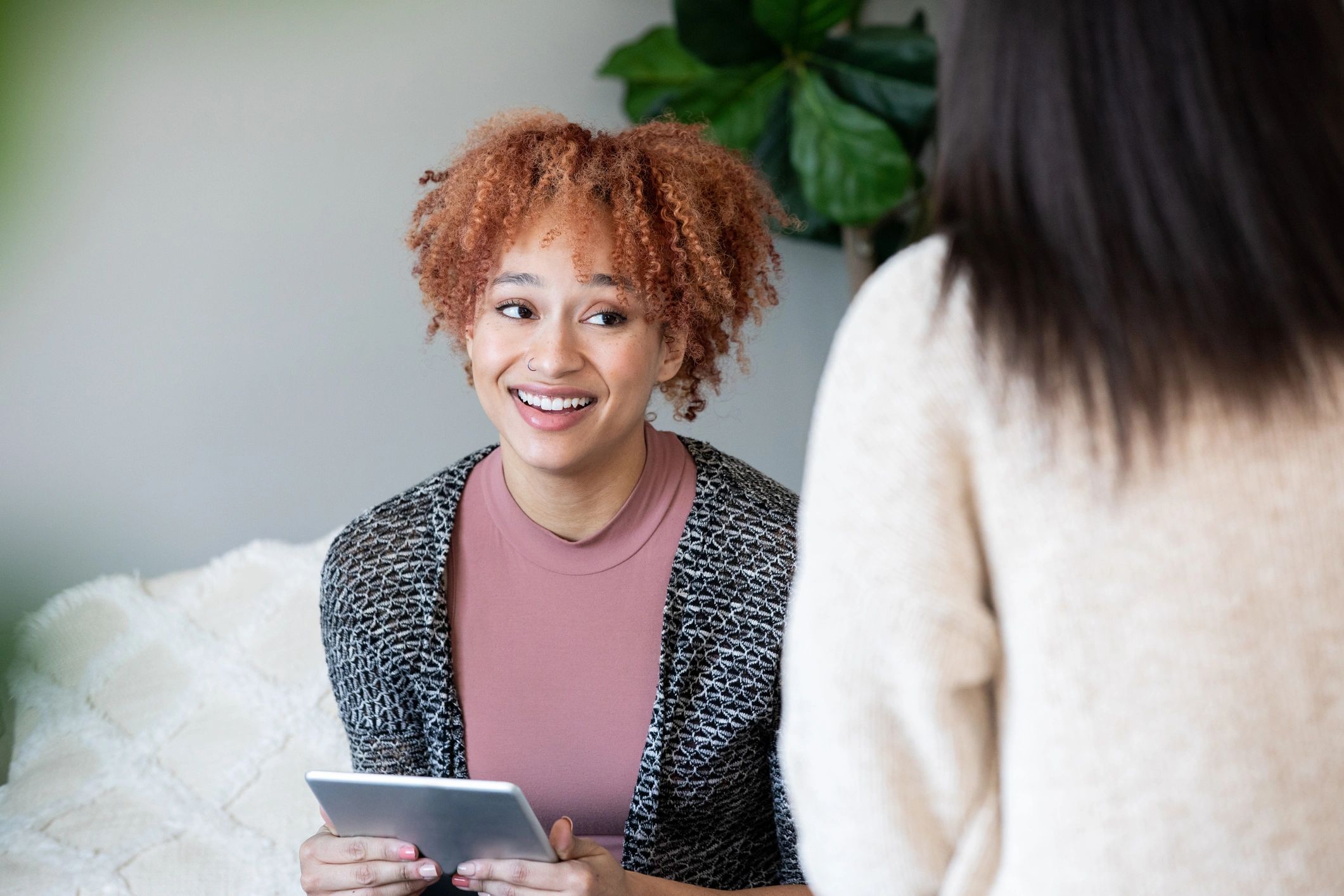 Life coach speaking with a client during a supportive coaching session